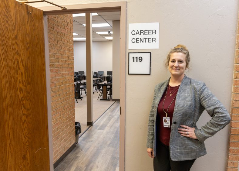 In this photo Research Librarian Ashley Bagwell stands beside the recently opened Career Center located in the David L. Boren Library on Seminole State College’s campus