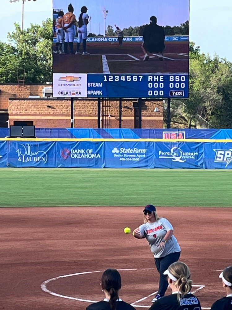 In this photo Seminole State College Athletic Director Leslie Sewell throws the opening pitch of the Oklahoma City Spark’s game against the Chattanooga Steam at Devon Park on July 3.
