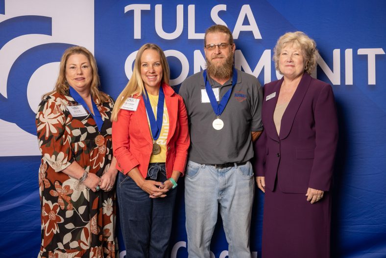 Pictured are Professional Staff Member of the Year Tina Savage, Faculty Member of the Year Emily Carpenter and Classified Staff Member of the Year Dwayne Castle posing for a photo after being recognized for their achievements by SSC President Lana Reynolds at the Oklahoma Association of Community Colleges Conference held on Oct. 4 at Tulsa Community College.