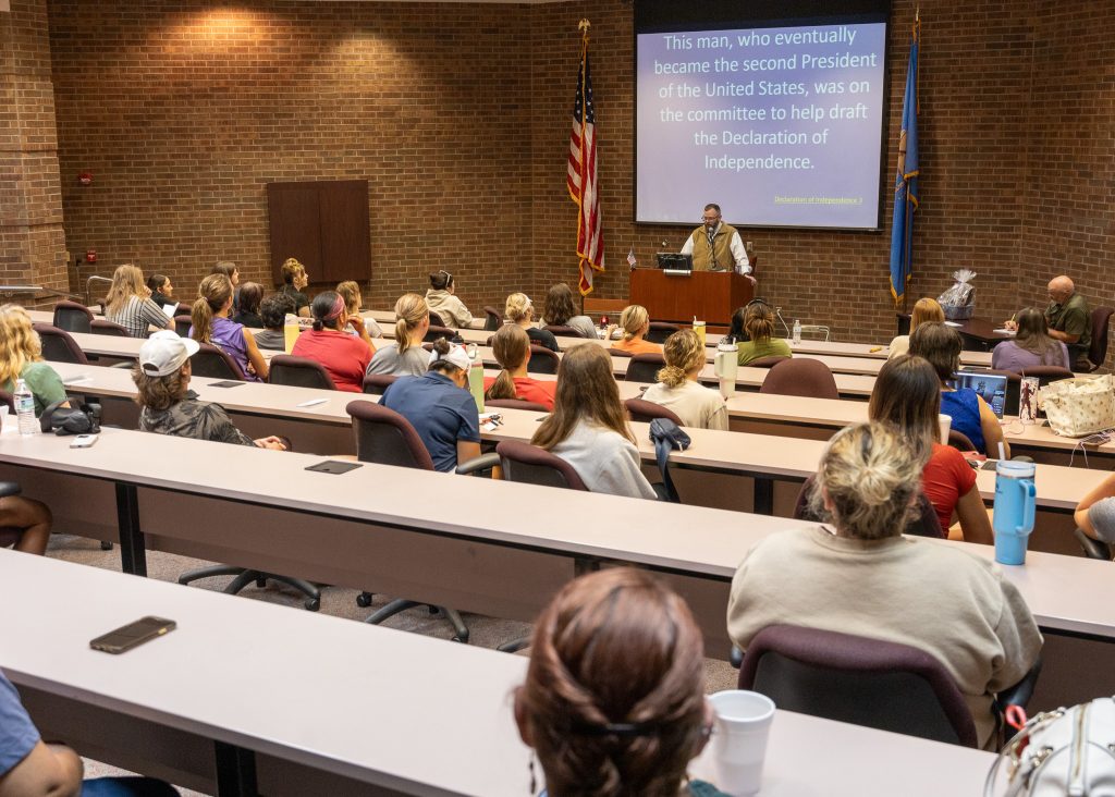 In this photo, Social Sciences Division Chair and Professor of Government Jeffrey Christian addresses the attendees of this year's Constitution Day celebration from a podium.