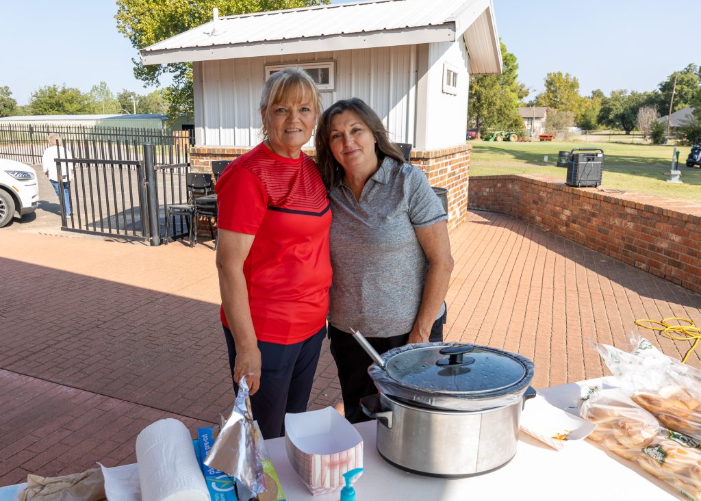 In this photo, SSC Educational Foundation Vice Chair Rhonda McKee (left) and SSC Regent Teresa Burnett (right) prepare and serve food as participants make their way along the course.