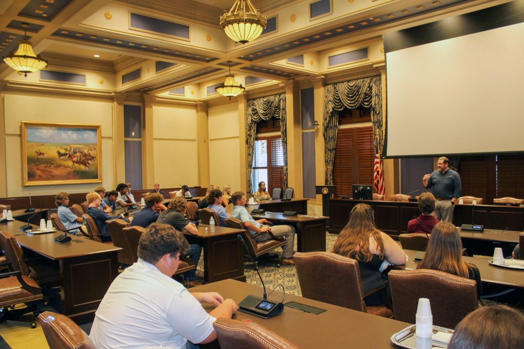 In this photo, Lynn Thompson, Communications and Development Director of the Oklahoma Academy, speaks with students about the grassroots push for open primaries, where voters would be able to vote in primary elections regardless of political party affiliation.