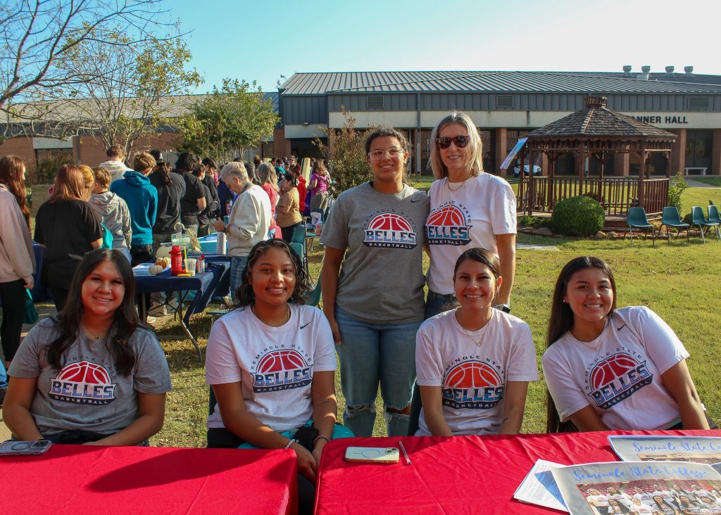 In this photo, members of the SSC Belles women’s basketball team pose for a group photo after signing autographs at the event. Ten of the 16 players on this year’s roster are Native American. Pictured (left to right): Hailey Mack of Varnum, Pauline Black-Harmon of El Reno, Jada Ponce of McAlester, Head Coach Rita Story-Schell, Jenna Bigfoot of Putnam City and Hiahni Howard of Stigler.