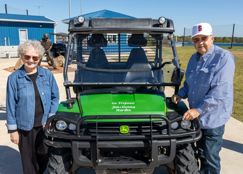 Pictured, SSC Educational Foundation Trustee Jim Hardin (right) and his wife retired SSC English Instructor Dr. Donna Hardin (left) pose with the John Deere Gator utility vehicle they donated.