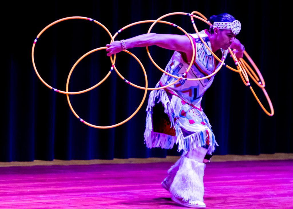 In this photo, Native American hoop dancer Eric Hernandezs showcases his talents in the Jeff Johnston Fine Arts Auditorium.