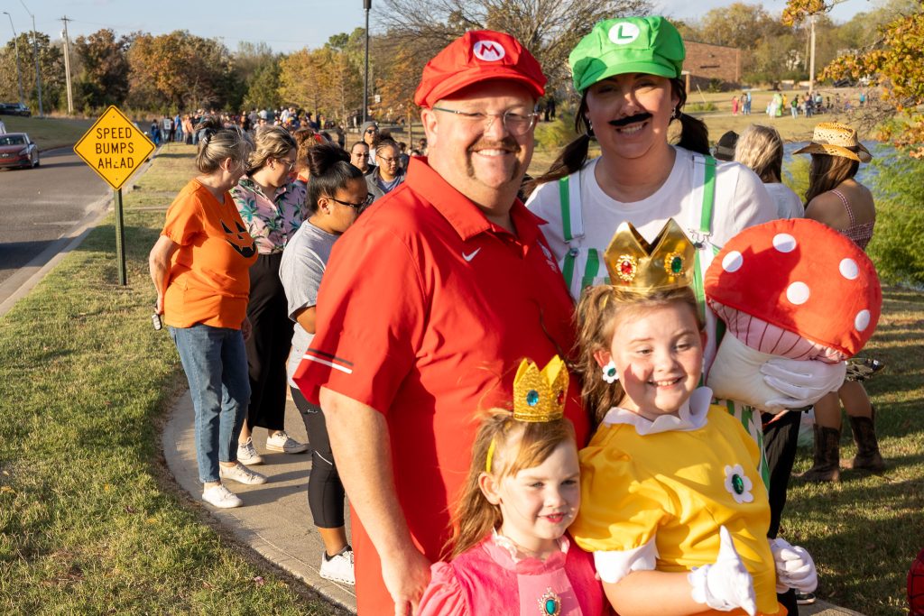 In this photo, SSC Regent Ryan Pitts, his wife Hillary and their two daughters, Reagan and Rylee, pose for a photo, attending the event dressed as characters from the Mario Bros. video game franchise.