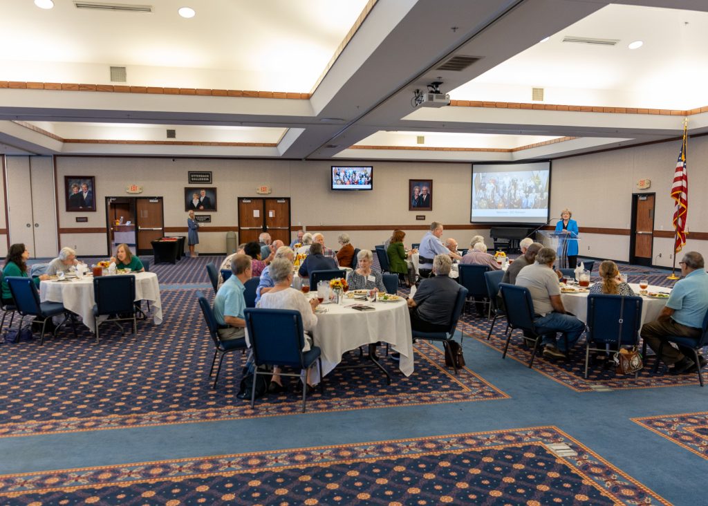 In this photo, SSC President Lana Reynolds welcomes former employees back to campus during a luncheon in their honor on Oct. 23.