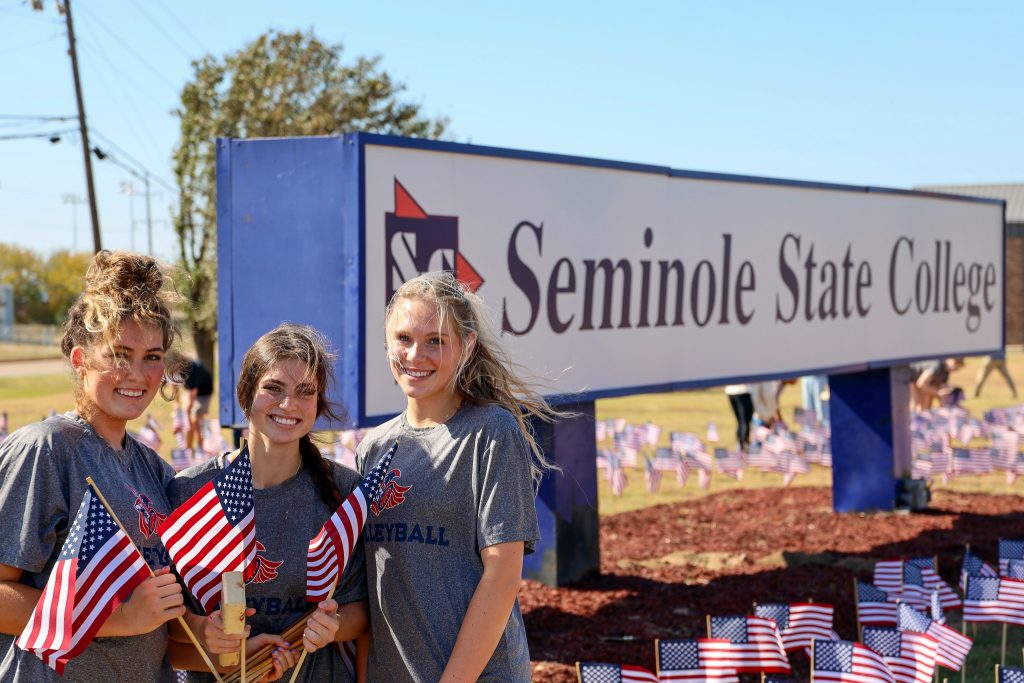 In this photo, SSC volley players pose for a photo while volunteering their time to plant flags. Pictured left to right are, Caeli Schaefer of Stillwater, Kara Doan of Little Elm, Texas, and Breana Stumbo of Lubbock, Texas.