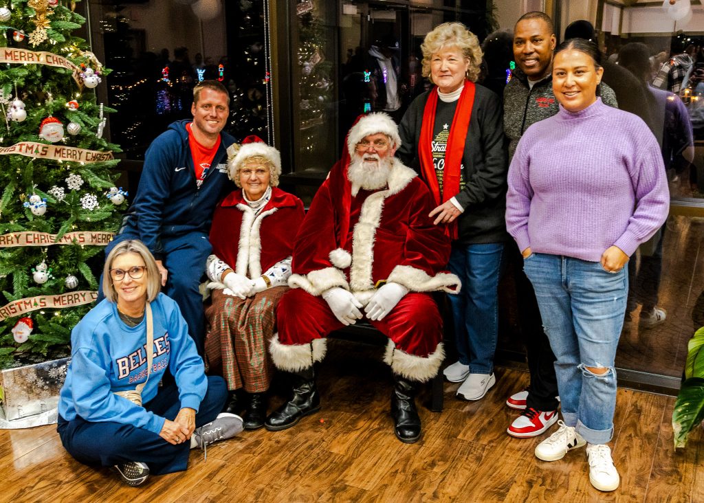 In this photo, Several of the SSC athletics staff pose for a picture with Mr. and Mrs. Clause. Pictured (left to right): Women’s Basketball Head Coach Rita Story-Schell, Women’s Soccer Head Coach Dan Hill, Mrs. Claus, Santa Claus, SSC President Lana Reynolds, Baseball Head Coach Mack Chambers and Women’s Softball Head Coach Amber Flores.