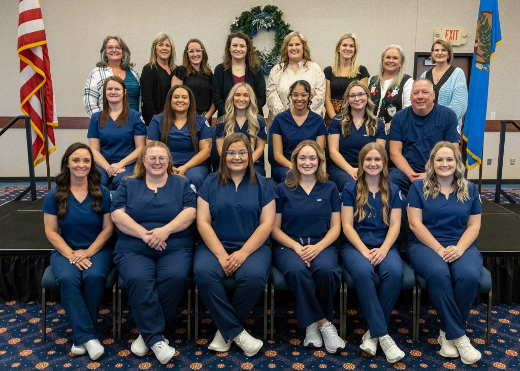 Nursing graduates and nursing faculty and staff pictured posing for a photo (left to right): Back Row: Nursing Program Advisor Carmen Hutchins, Nursing Program Office Manager Julie Mathews, Assistant Professor of Nursing Damaila Lester, Assistant Professor of Nursing Miranda Stewart, Director of Nursing Dr. Misty Gray, Assistant Professor of Nursing Jessica Shelburne, Assistant Nursing Professor Ann Benson and Assistant Professor of Nursing Christine Clay.

Middle Row: Kaylah Larmen, Tori Annanders, Ragan Dauzat, Daisha Minner, Hailey Fairres and Dusten Lancaster. Front Row: Falisha Wood, Crystal Davis, Kasey Balderrama, Adrienne Foster, Emylee Keith and Paige Kelly.