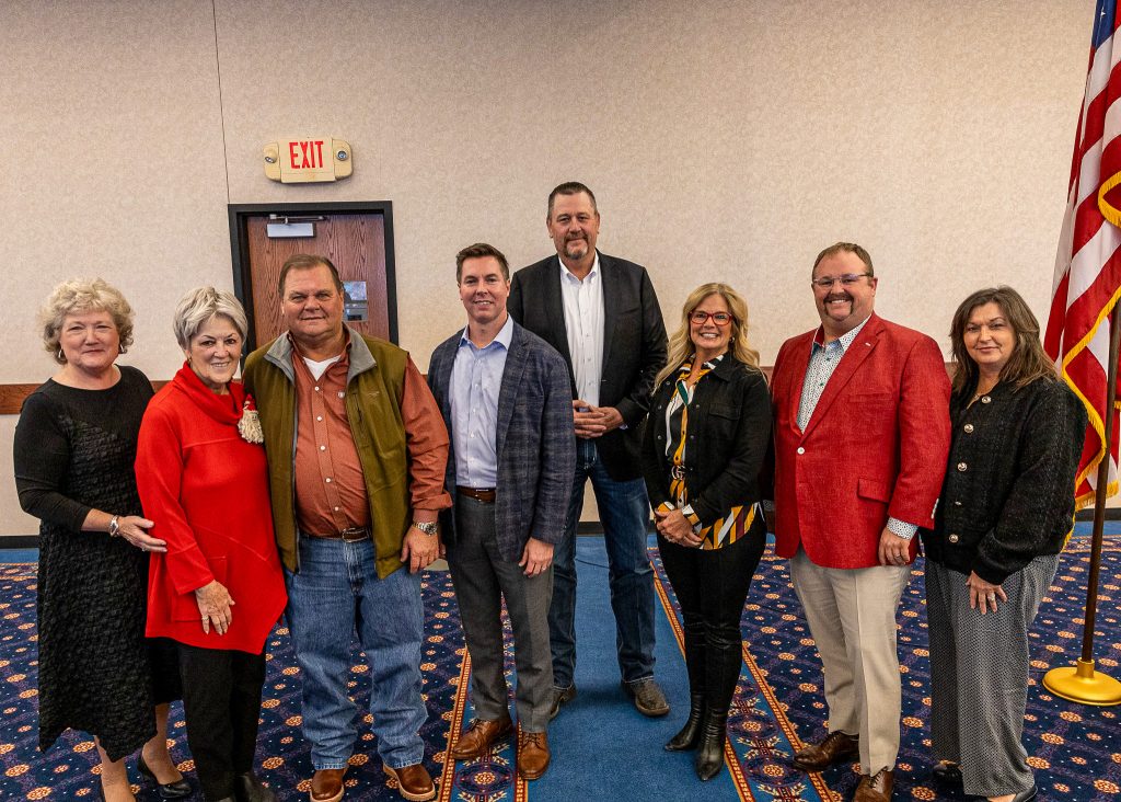 In this photo, pictured left to right, President Lana Reynolds, Regents Marci Donaho and Curtis Morgan; State Senators Adam Pugh and Grant Green; Regents Robyn Ready, Ryan Pitts and Teresa Burnett pose for a group photo.