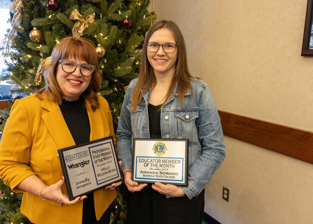 In this photo Director of Human Resources Holly Wilson-Byrd (left) as the Staff Member of the Month and Assistant Professor of Microbiology Amanda Soward (right) pose for a photo after being recognized. 