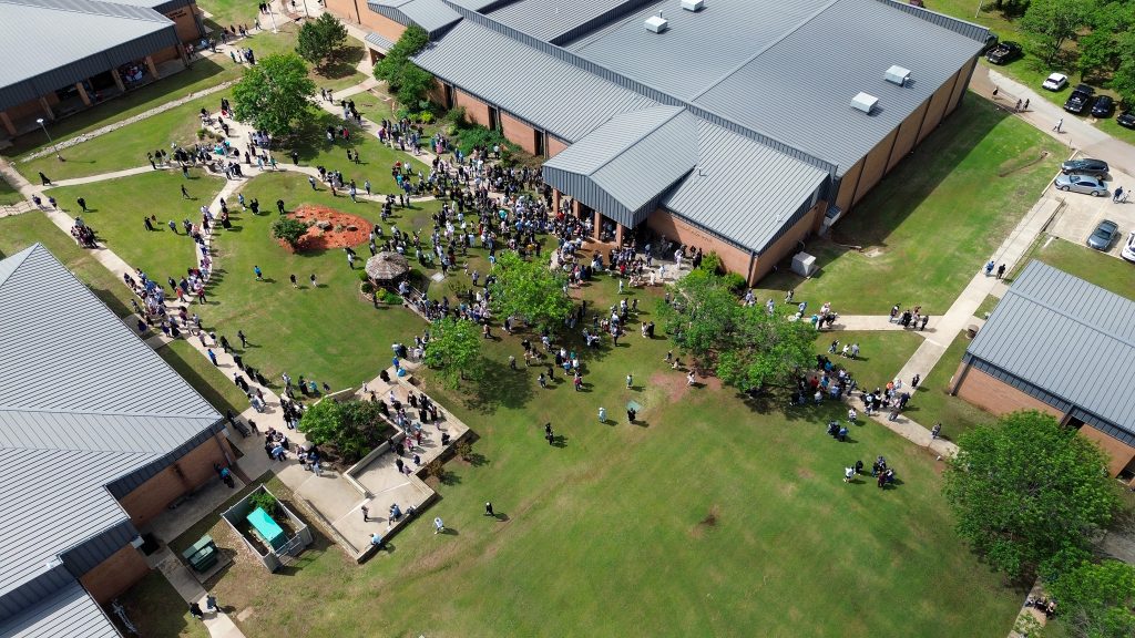 In this photo, an ariel view of students crowding the courtyard on SSC's campus is shown.