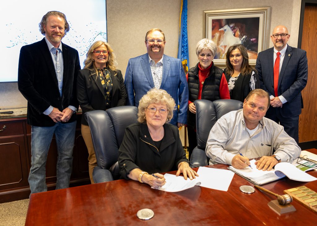 In this photo, pictured (seated, l-r): President Reynolds, Chair Curtis Morgan; (standing, l-r) Regents Ryan Franklin, Robyn Ready, Ryan Pitts, Marci Donaho, Teresa Burnett and Bryan Cain pose for a group photo.