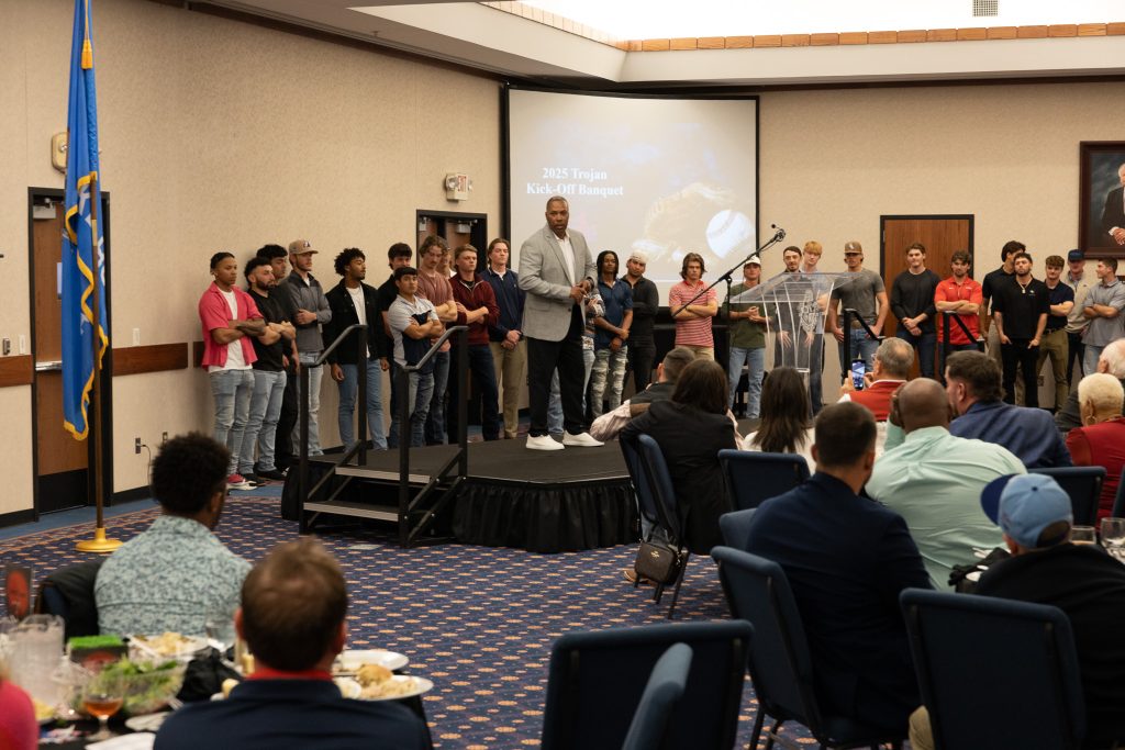 In this photo, SSC Baseball Head Coach Mack Chambers stands in front of the crowd with his players behind as he introduced this year’s team.