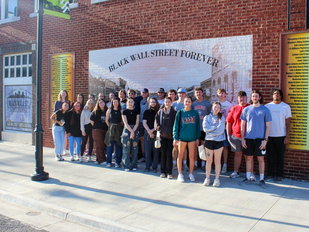 In this photo, SSC leadership students pose for a group photo in front of a neighborhood mural in Tulsa’s historic Greenwood District.