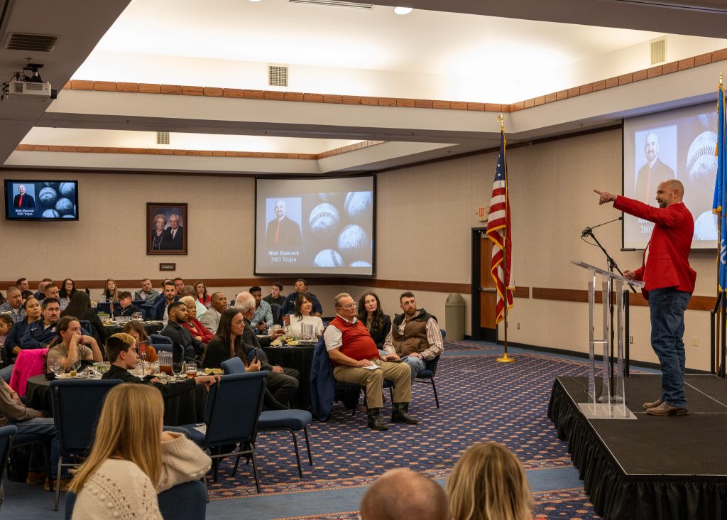 In this photo, Matt Hancock, 2003 Trojan alumnus and current Director of Tulsa County Parks and Recreation, addresses the crowd of attendees from the stage as the event’s featured speaker.