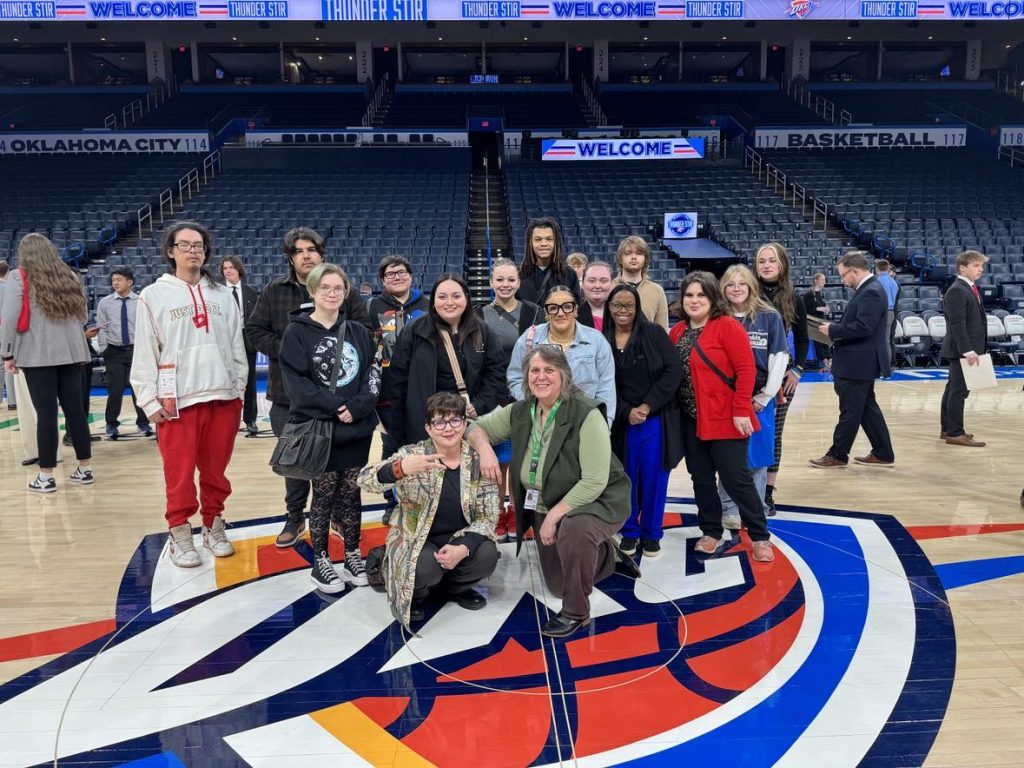 In this photo, Seminole State College students and Student Support Services/SSS STEM staff pose for a group photo at center court in the Paycom Center during the Thunder Stir career fair on Feb. 24.