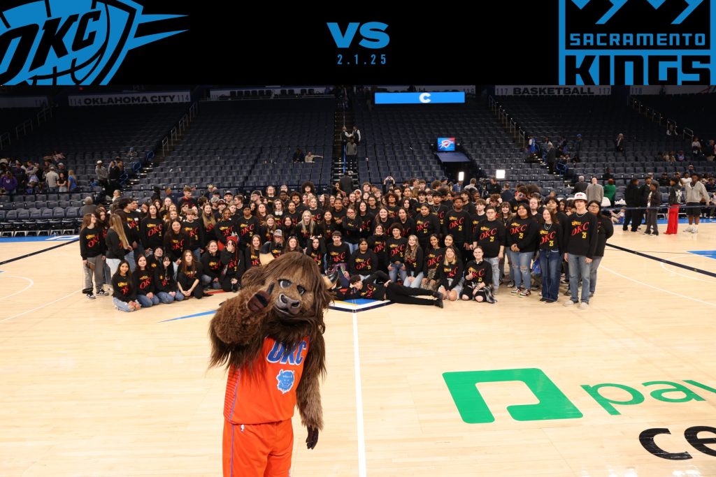 In this photo, more than 120 high school students in the Seminole State College Upward Bound program pose on the basketball court for a group photo with the Oklahoma City Thunder Mascot, Rumble the Bison.