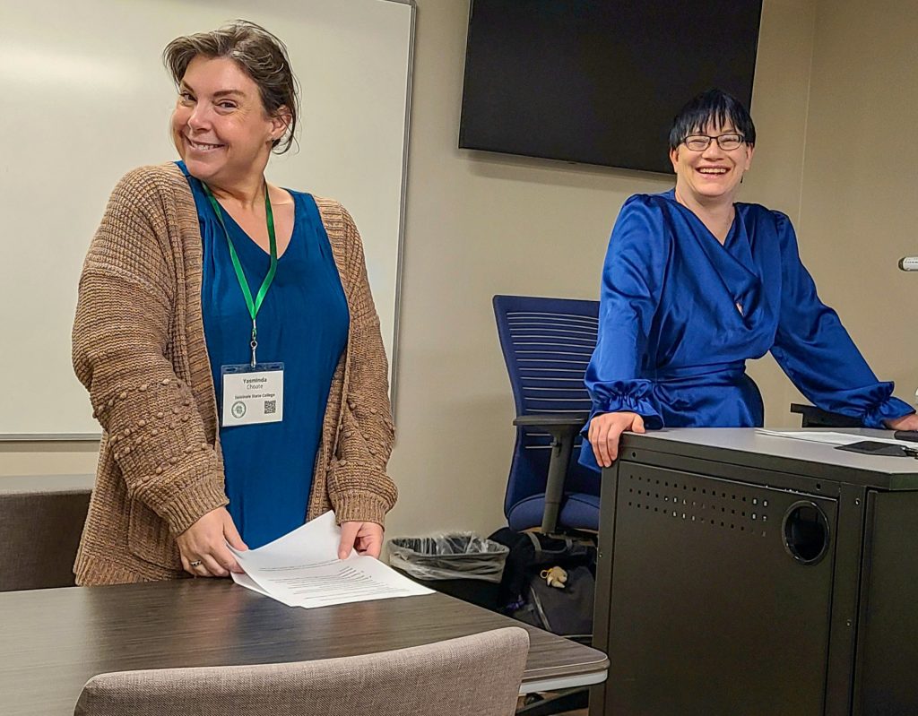 In this photo, Kara Stanley (right), SSC Adjunct Professor of Biology, and Associate Professor of English Yasminda Choate pose for a photo after delivering a presentation.