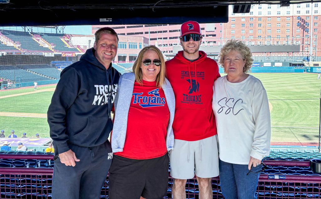 Posing for a group photo are (left to right): SSC Women's Soccer Head Coach Dan Hill, Athletic Director Leslie Sewell, Men's Basketball Coach Austin Bogle, and President Lana Reynolds.